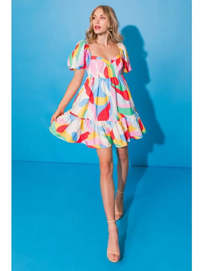 Weezie D. Colorful Mini Babydoll Dress has a beautiful flare for a flirty fun look. Wear to summertime special occasions or on a chill shopping day. 