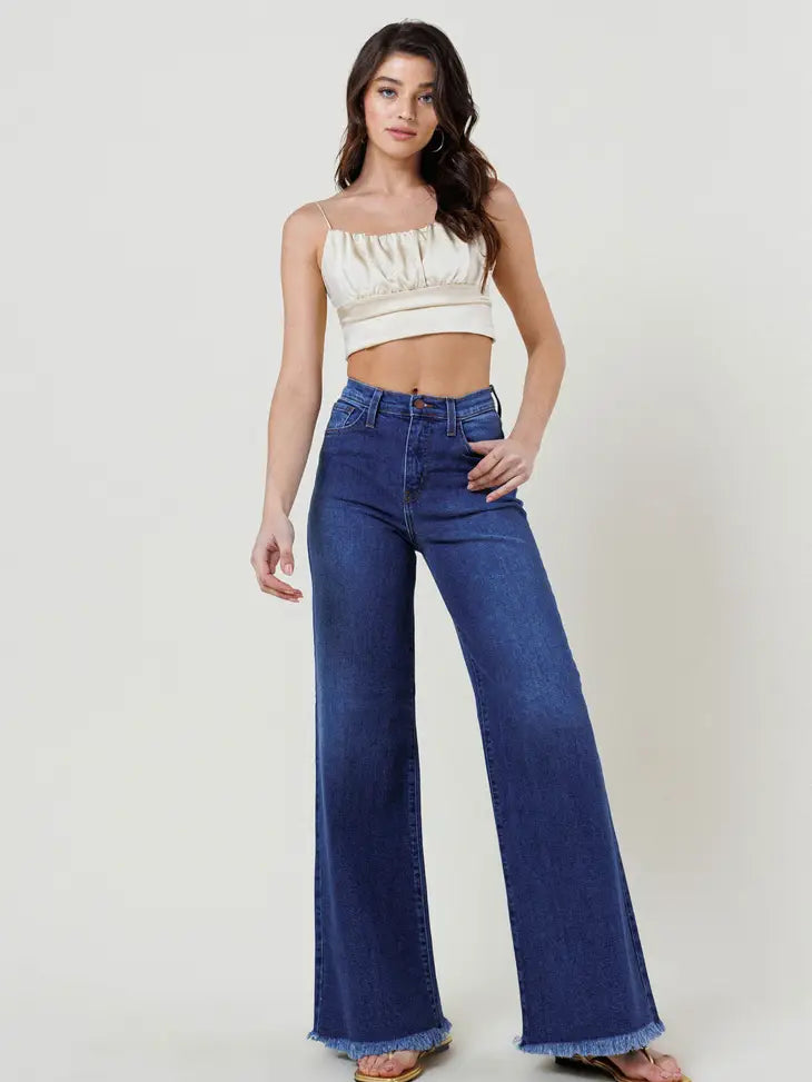 Weezie D. High Waist Wide Flood Denim Jeans are fit to perfection. Blue wash fringed bottom hem classic 5 pocket detail & hidden zipper closure. High waist silhouette for tucking in shirts & tops while feeling properly contoured. Comfortably move with the bend & stretch of our denim. Compliment  your curves. 96% Cotton 3% Polyester 1% Spandex.
