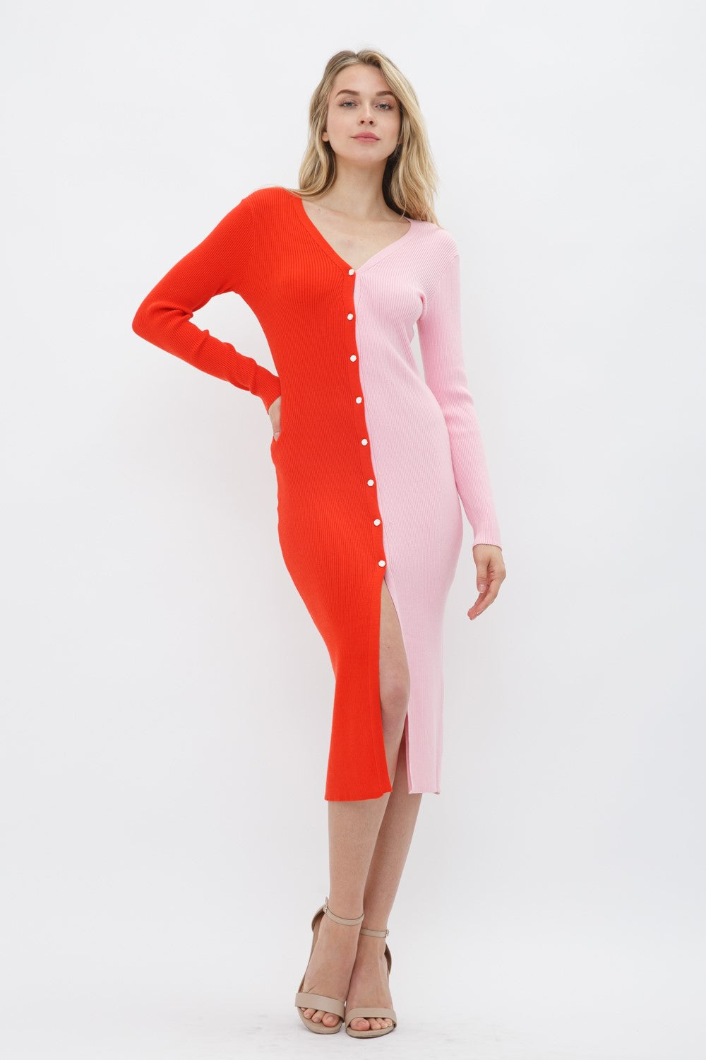 Weezie D Pink Goes Orange Stretch Knit Button Up Dress is ribbed & color blocked for a modern twist to the class sweater dress that will fit your curves perfectly. V-Neckline, long sleeves & white enamel buttons make our dress a more elevated choice. We love style that meets comfort 50% Viscos 28% Polyester 22% Nylon