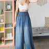 Weezie D. Tencel High Waist Wide Flood Pants has elastic 4" wide smocked waist band, loose relaxed stylish fit that can be worn with fun t-shirts, tops or even a tank. Featuring side pockets & an easy pull on style. Clean back finish for a more seamless look. 100% Tencel fabric is breathable, soft & high quality. 