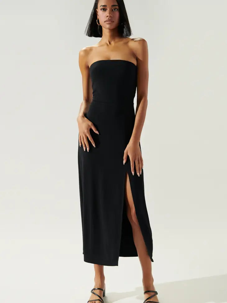 Weezie D effortlessly chic & simple Tube Jersey Knit Black Midi Dress. Take our look from day to night & on vacation. Buttery soft jersey knit fabric has the perfect amount of stretch & feels great on your skin. Side slit adds an elevated feminine flair. Pair with flat sandals or wedges & sunhat. 96% Rayon 4% Spandex 