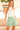 Knit halter top in off white for women