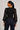 Back view of black 3D floral sleeve rib knit sweater