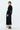 Back view of elegant black A-line knit midi dress