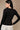 Back view of black fitted long sleeve stretch jersey top