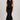 Black knit peplum top and fitted midi skirt set front view
