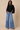 Front view of ivory tie back batwing sleeve top