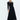 Front view of black twist front stretch knit midi dress with gold hardware