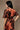 Back view of brown floral satin top with tie waist