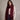 Burgundy cashmere feel fringe wrap scarf styled around neck with cream knit sweater and blue jeans