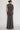 Back view of charcoal gray ruched wide leg pants set showing the draped jersey top and relaxed full-length pants