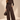 Front view of chocolate brown wide barrel leg knit pants with seam detailing, pockets and button tab hems