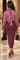 Back view of eggplant purple knit maxi skirt with smooth fitted silhouette and long hemline