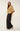 Side view of gold sequin tweed puff sleeve jacket highlighting dramatic sleeve volume and softly structured silhouette