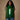 Hunter green cashmere feel fringe wrap scarf worn around neck with white sleeveless top and blue jeans