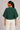 Back view of hunter green dolman sleeve knit top with sculpted silhouette