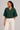 Hunter green dolman sleeve knit top with gold buttons front view