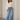 Front view of ivory 3D floral sleeve rib knit sweater
