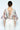 Back view of ivory floral bodysuit with tassel tie detail