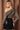 Back view of olive one shoulder long sleeve draped top