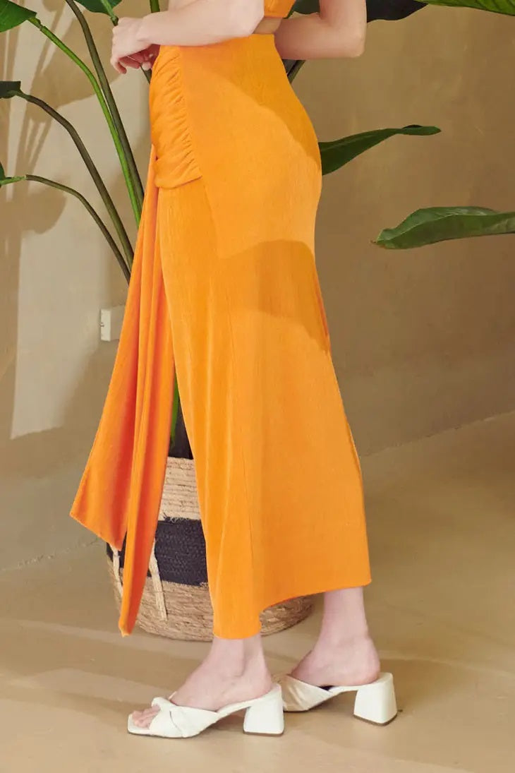 Weezie D. Tangerine Orange Slinky Skirt Set is a perfect vacation outfit or wear to those special occasion events. Great stretch and fits so perfectly on most. Slay your summer time style. 