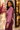 Side view of orchid satin draped wrap blouse showing gathered shoulders, flowing sleeves and elegant wrap front