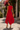 Back view of elegant red sleeveless midi dress with belt