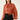Front view of rust pearl embellished tie neck chiffon blouse with shimmering fabric, tonal pearls and balloon sleeves