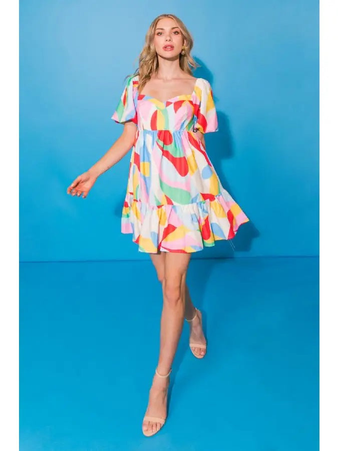 Weezie D. Colorful Mini Babydoll Dress has a beautiful flare for a flirty fun look. Wear to summertime special occasions or on a chill shopping day. 