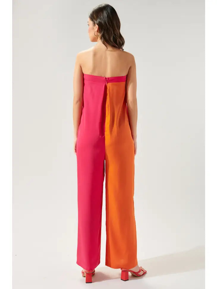 Weezie D Orange & Pink Color Block One Piece Jumpsuit is fun & perfect to take on vacation. It's strapless with side pockets, split pleat front leading into wide leg pants. 5% Nylon adds some stretch to this look. Add your favorite sun hat or headwrap for a balanced stylish look. 95% Polyester 5% Nylon.