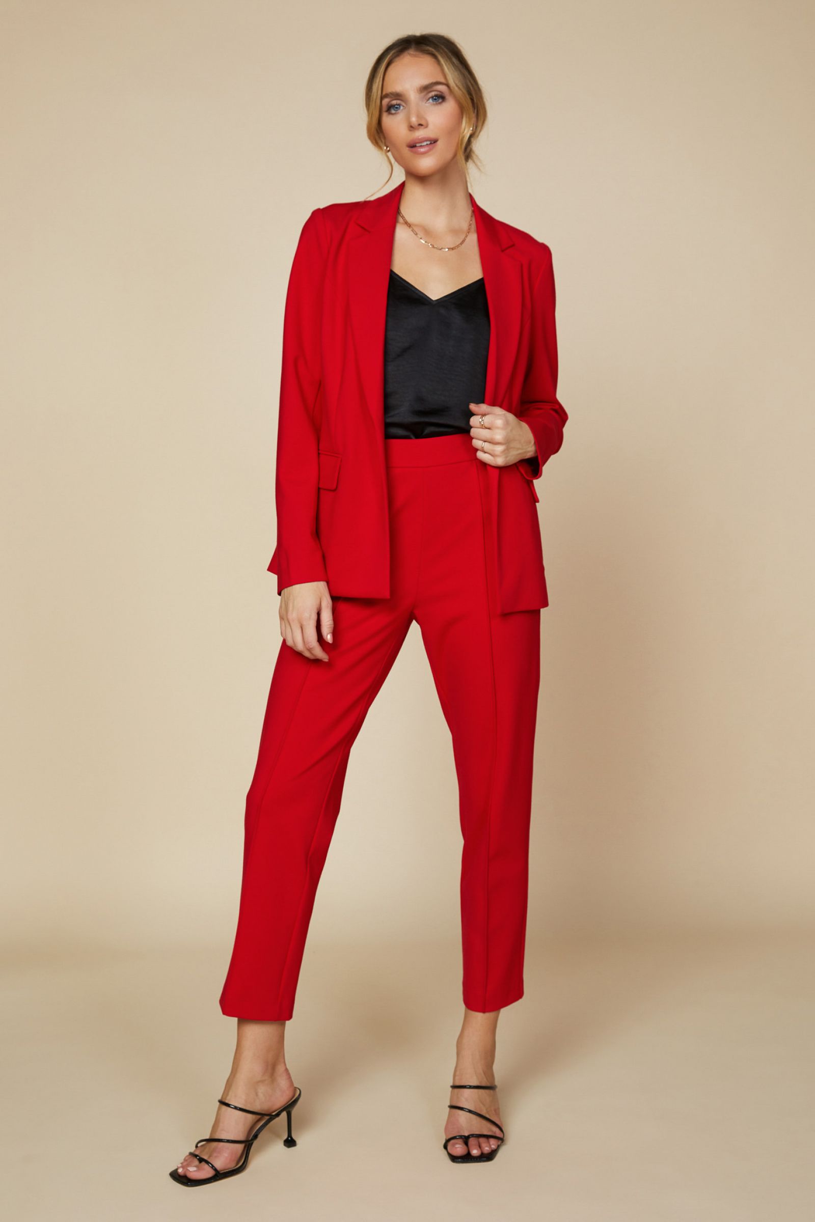 Knit Red Pintuck Pull Up Trouser Pants in Scarlet Red is Stretch and the perfect way to suit up in a comfortable way. 5% Spandex and elastic waist back adds some stretch to compliment your curves. Our red hot pants have side pockets and are a relaxed fit. 70% Rayon 25% Polyester 5% Spandex. Check out the jacket too. 