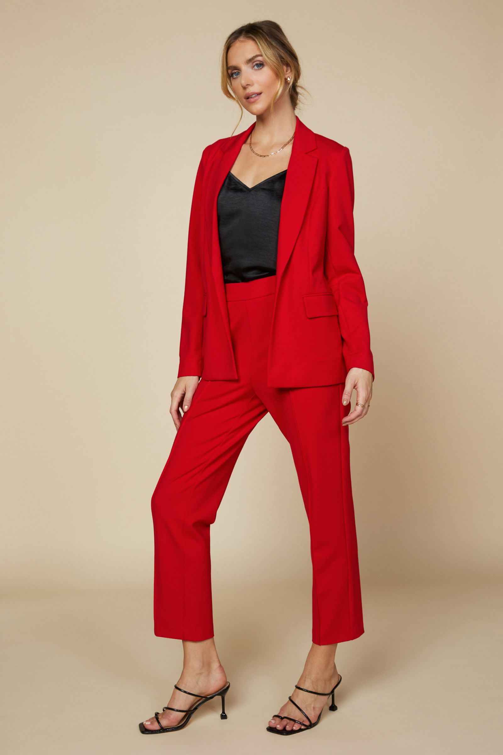 Knit Red Pintuck Pull Up Trouser Pants in Scarlet Red is Stretch and the perfect way to suit up in a comfortable way. 5% Spandex and elastic waist back adds some stretch to compliment your curves. Our red hot pants have side pockets and are a relaxed fit. 70% Rayon 25% Polyester 5% Spandex. Check out the jacket too. 