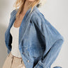 We love the color, wash & feel of our Mineral Washed Blue Denim Jacket. Soft & comfortable to throw on over your favorite t-shirt or top. V Neck fold over collar leads to button down closure, elastic wrist cuffs & elastic waistband. The side pockets are convenient & functional. Relaxed fit, 100% Cotton, Elastic jean details. 