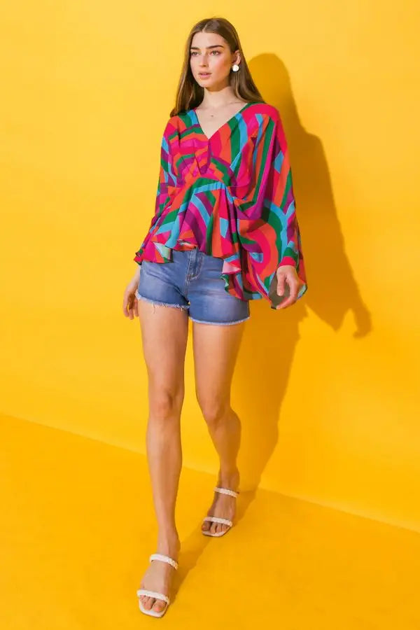 Weezie D. Happy Colors Printed Top sends us on a kaleidoscope of colors. Upscale the look with a pencil skirt & heels for ladies brunch or a more casual look with denim to date night. Dolman drop long sleeves flow with each movement. V-Neckline & relaxed fit. Great quality & feels like silk on your skin 100% Polyester
