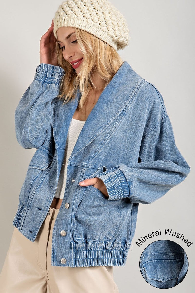 We love the color, wash & feel of our Mineral Washed Blue Denim Jacket. Soft & comfortable to throw on over your favorite t-shirt or top. V Neck fold over collar leads to button down closure, elastic wrist cuffs & elastic waistband. The side pockets are convenient & functional. Relaxed fit, 100% Cotton, Elastic jean details.